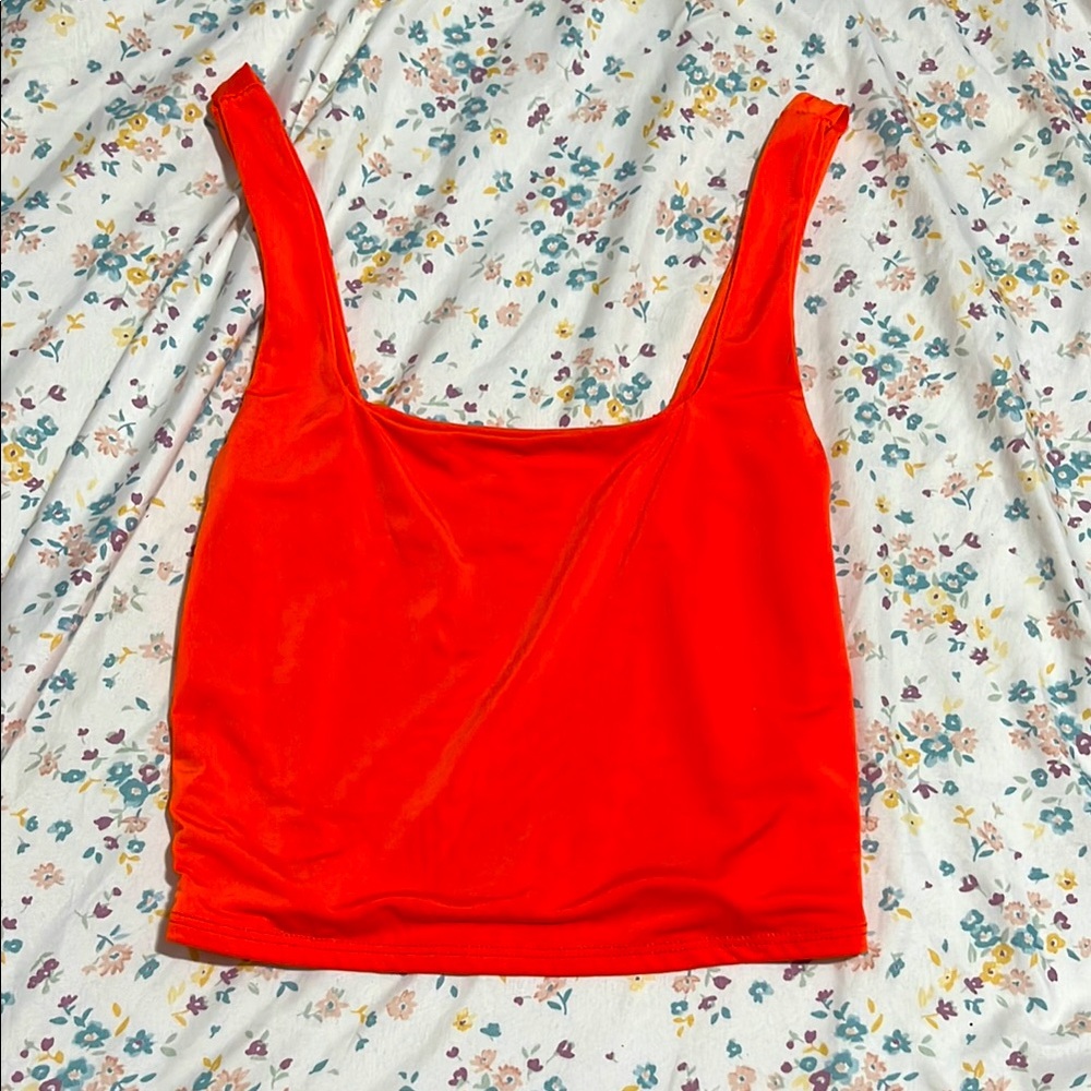 This top has a square neck, and is bright orange! Only worn maybe twice.